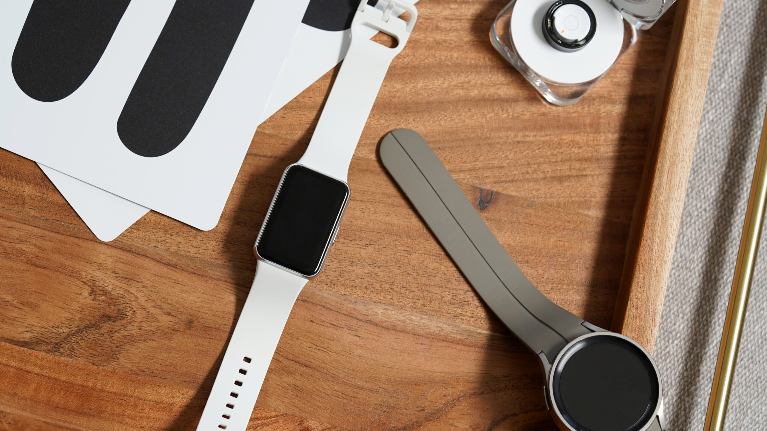 Samsung Galaxy Fit 3 Ring 5 Pro A Samsung Galaxy Fit 3 rests alongside a Galaxy Ring and Galaxy Watch 5 Pro